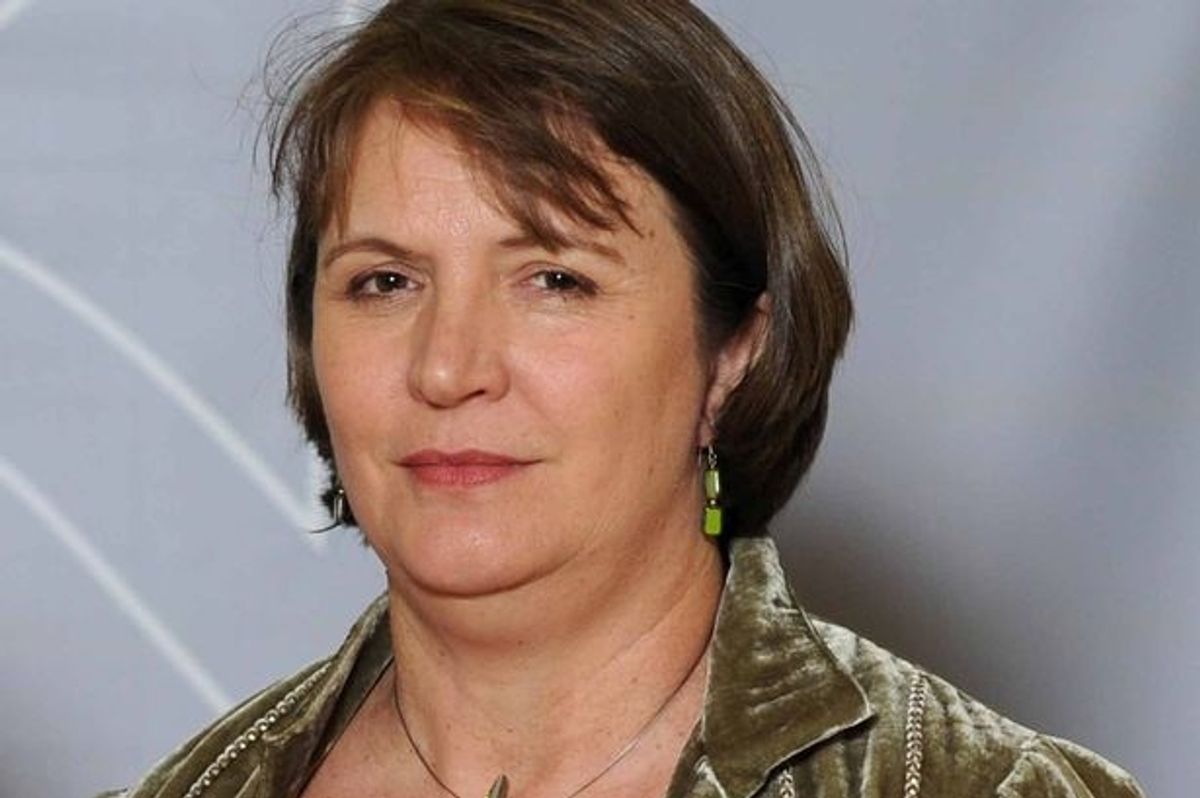 A smartly-dressed white woman with brown hair styled in a bob