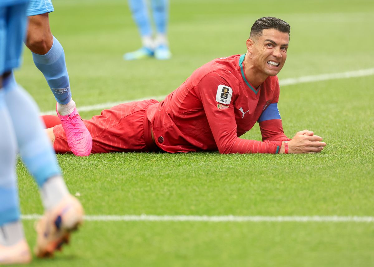 Cristiano Ronaldo lies on the pitch