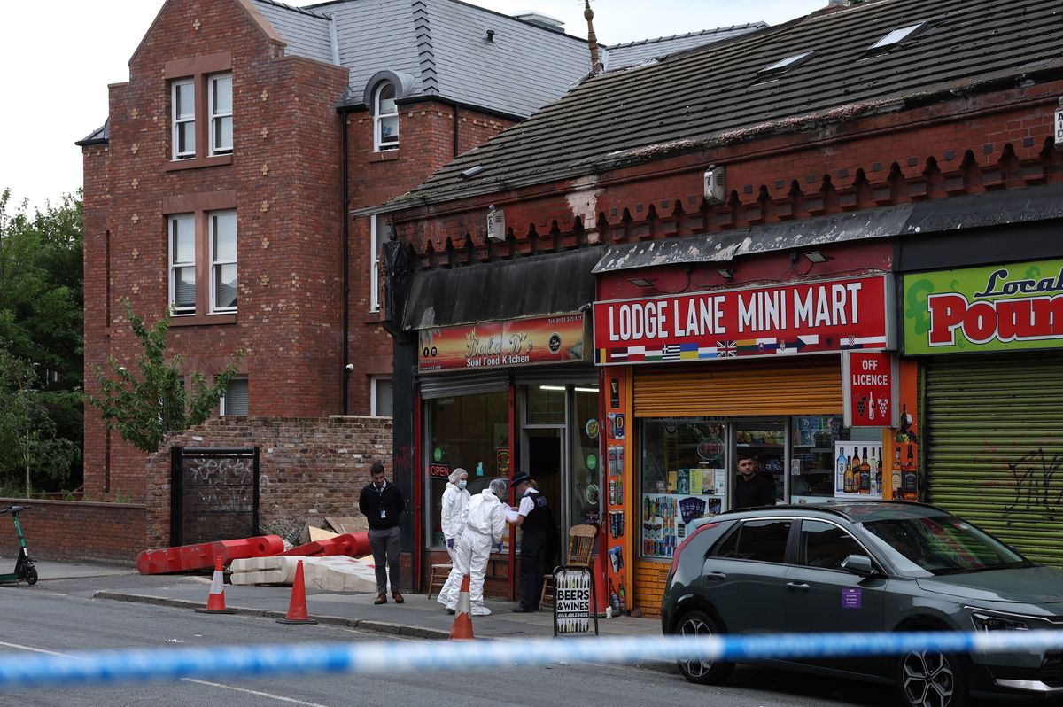Forensics at the scene of a shooting on Lodge Lane this evening