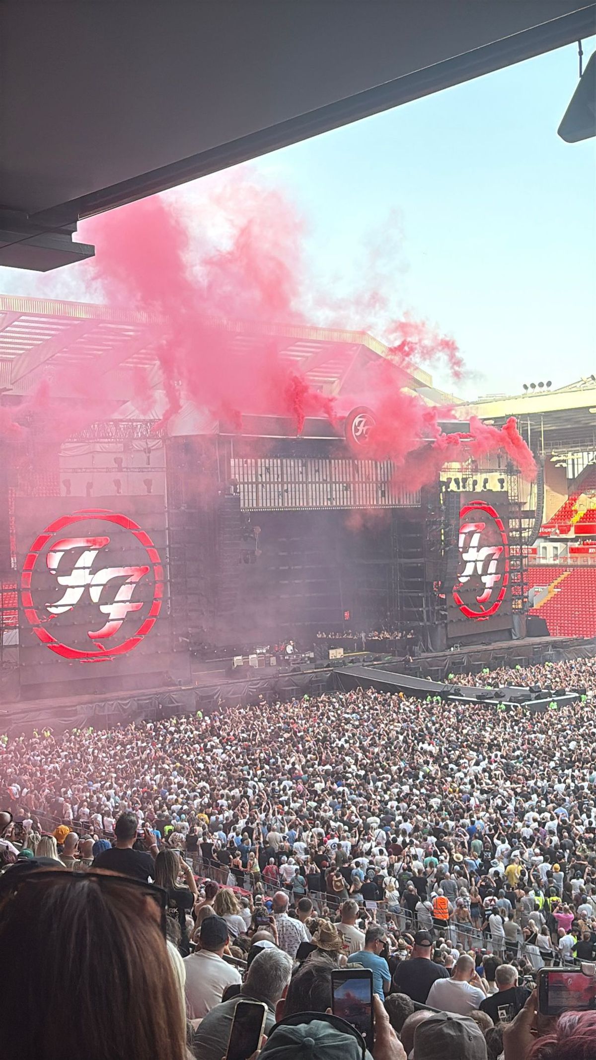 Red smoke fills Anfield Stadium during Foo Fighters' opening song