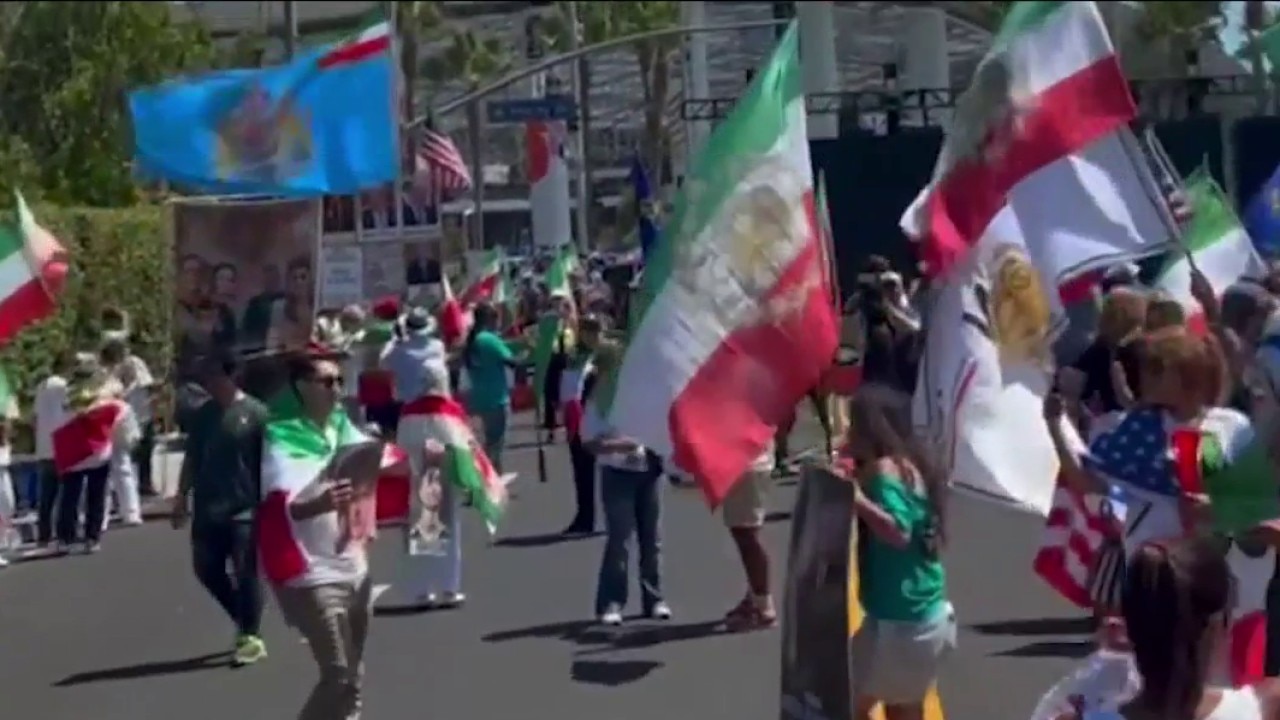 Iran plays first World Cup match as protesters form crowds outside stadium