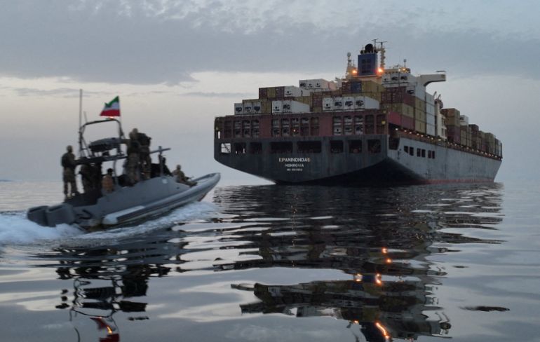 Small boat pursues big ship