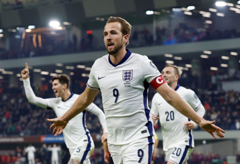 England's Harry Kane celebrates scoring their first goal 