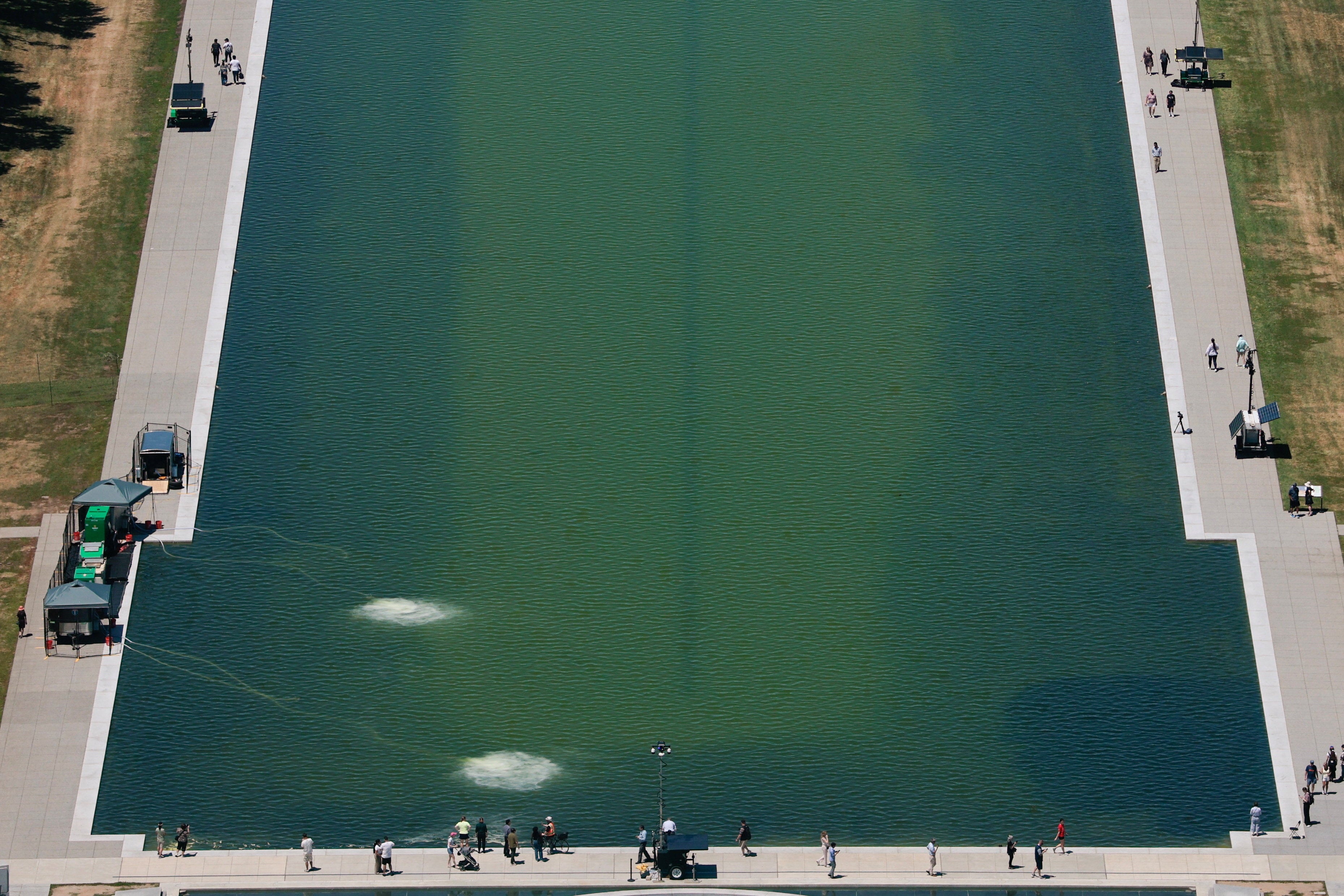 A view of the greenish Lincoln Memorial Reflecting Pool after recent renovations following a directive from U.S President Donald Trump to paint it blue