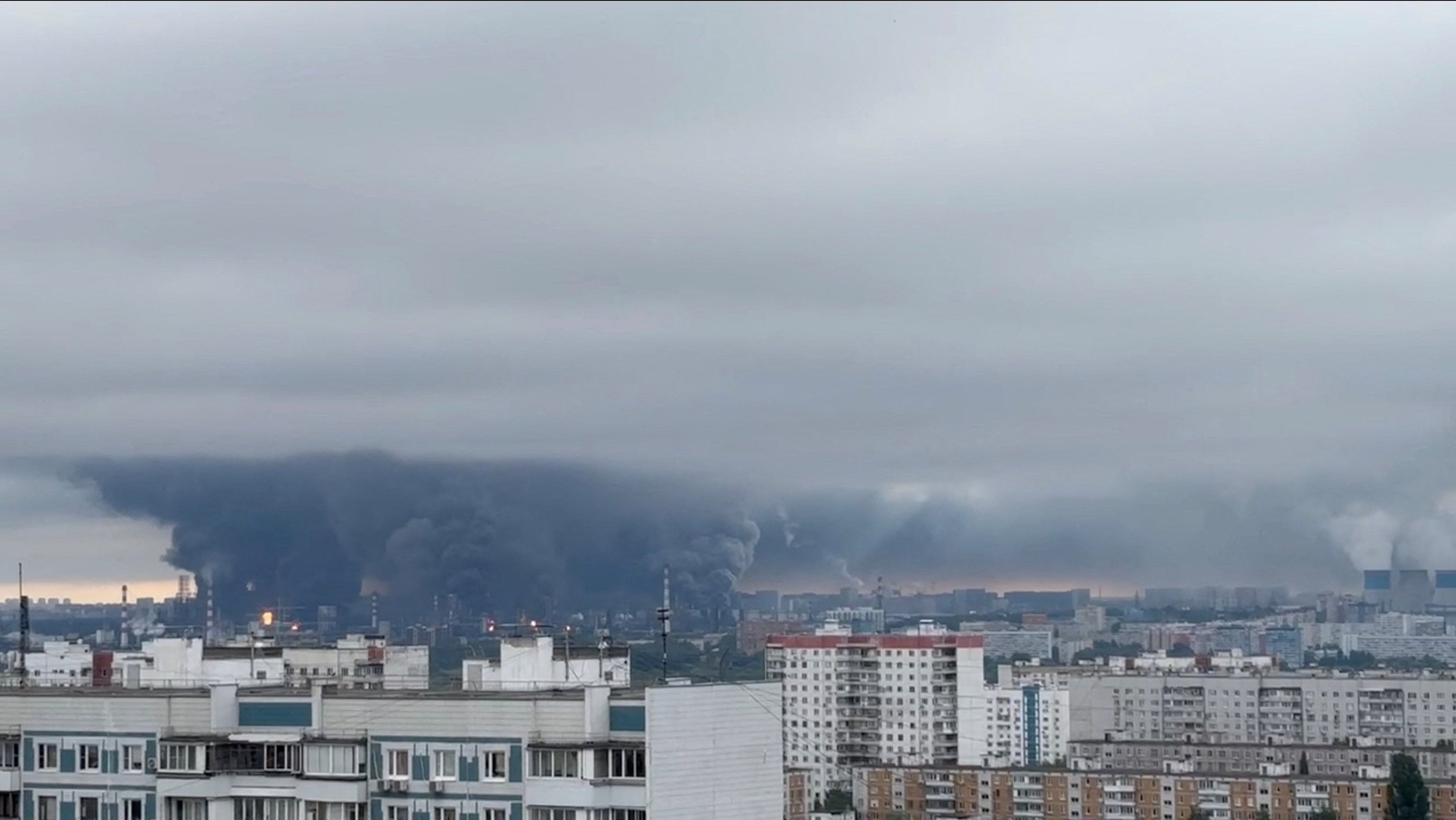 Flames and plumes ⁠of smoke rise over the south-eastern district of Kapotnya after major oil refinery attacked