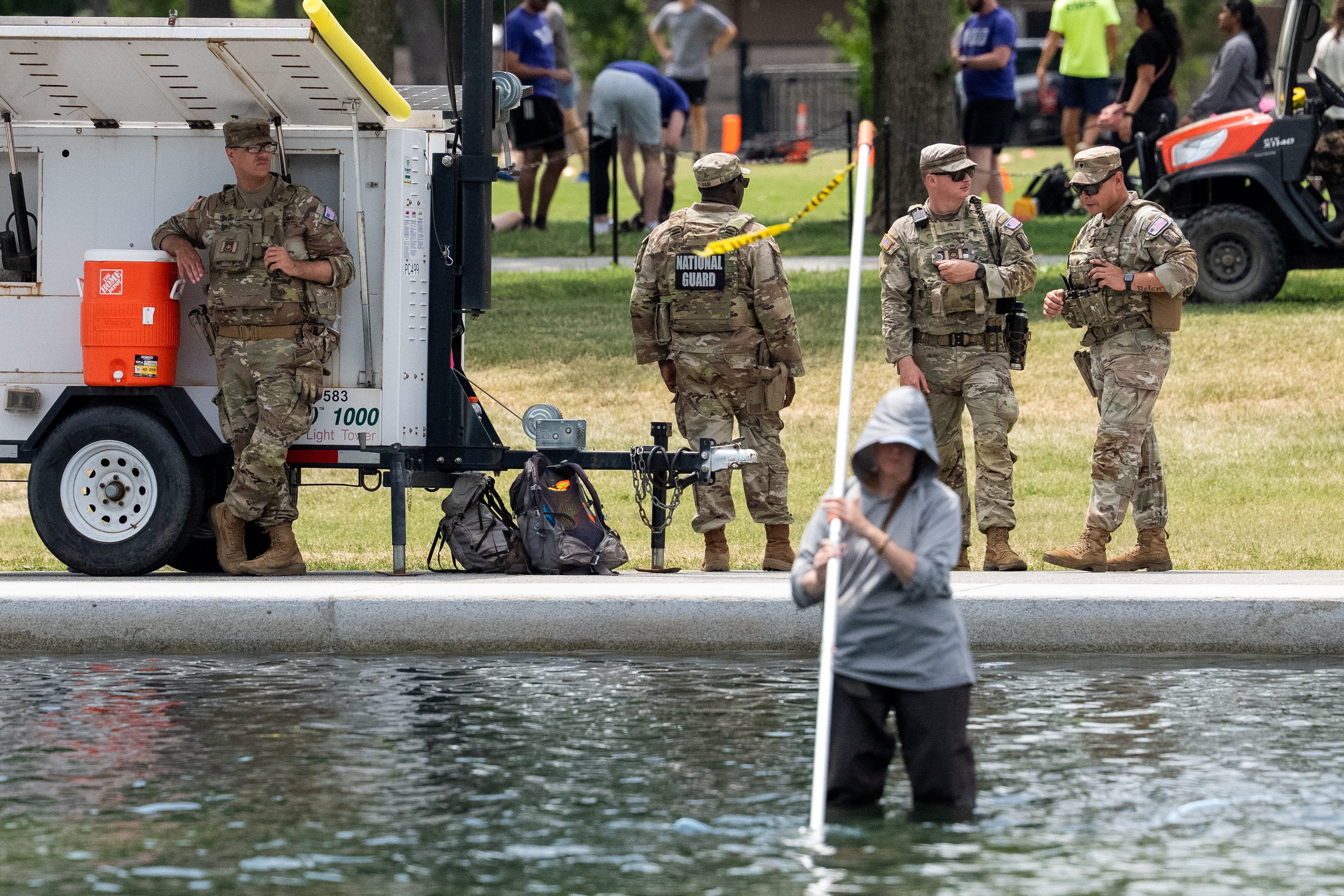 Days after $14.7 million renovations were completed at the landmark, crews have been clearing out algae blooms as pieces of the Trump-requested ‘American flag blue’ sealant bob to the surface