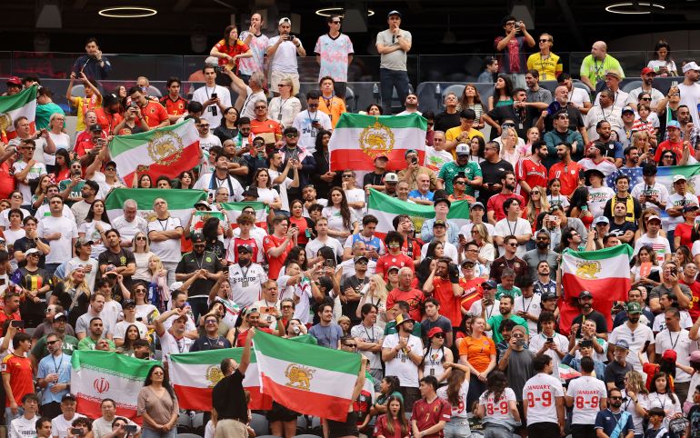 Soccer Football - FIFA World Cup 2026 - Group G - Belgium v Iran - Los Angeles Stadium, Inglewood, California, U.S. - June 21, 2026 Iran fans display pre-Iranian Revolution "Lion and Sun" flags inside the stadium before the match