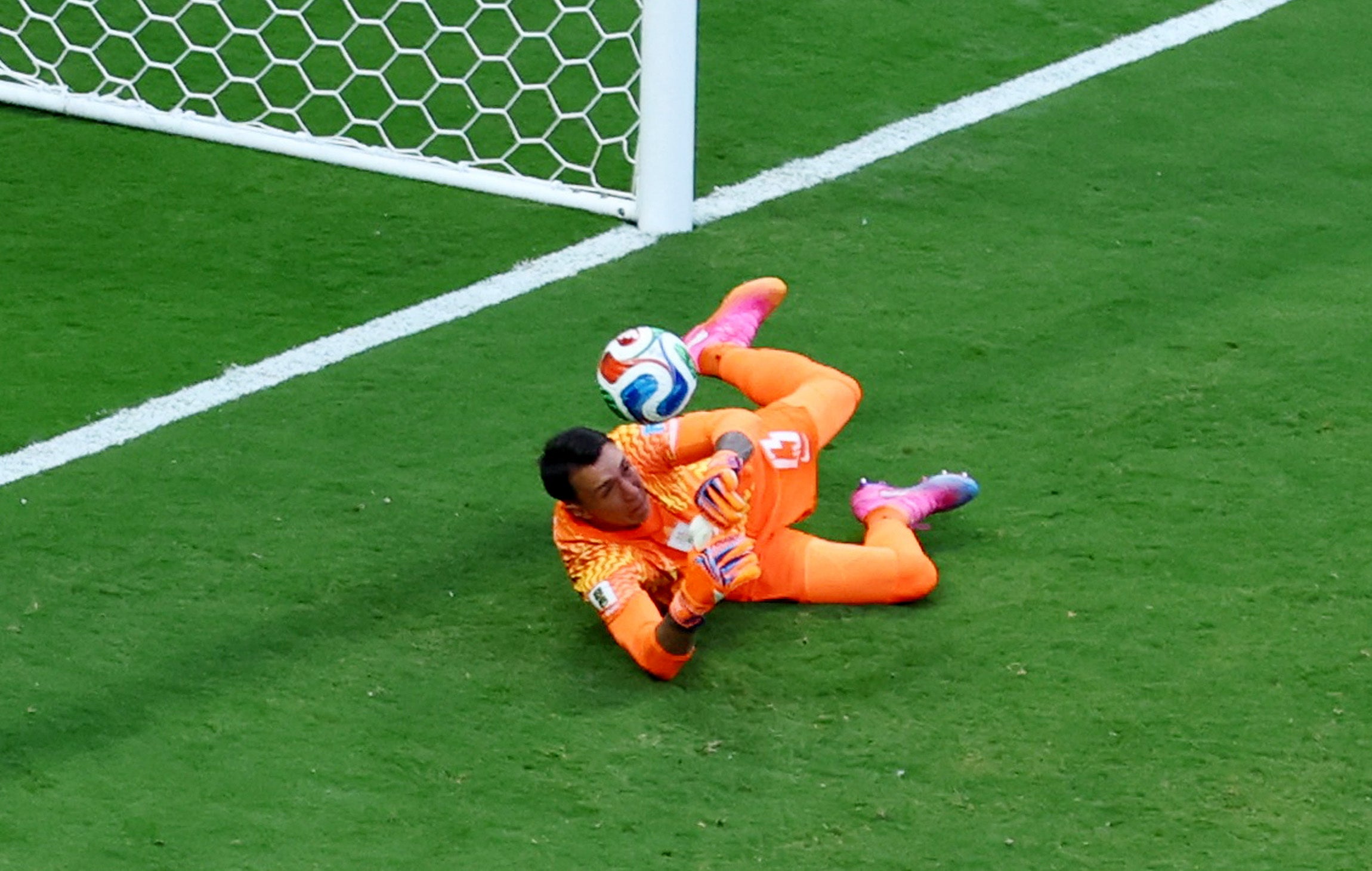 Spain's Alex Baena scores their first goal past Uruguay's Fernando Muslera