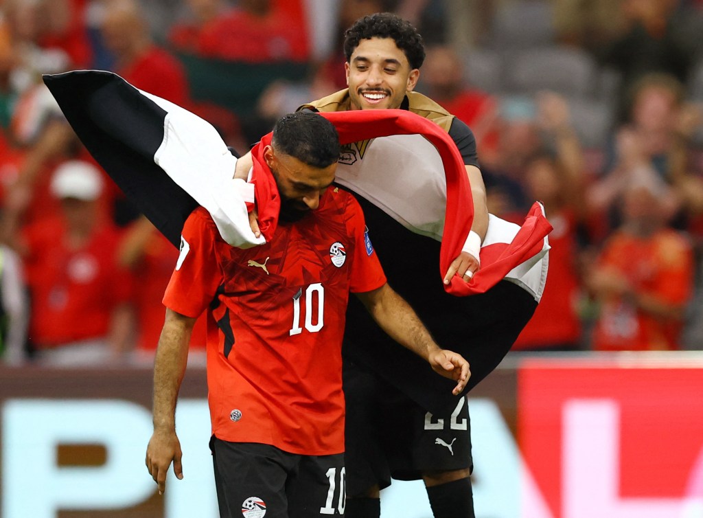 Egypt's Mohamed Salah celebrates with Omar Marmoush after their match against New Zealand.
