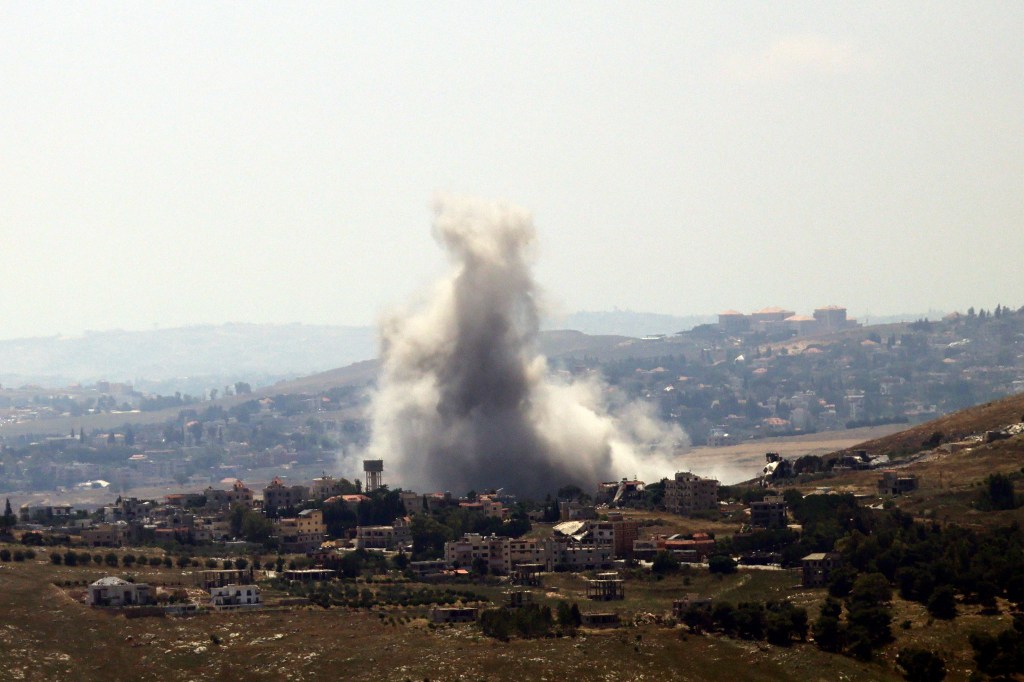 Smoke rising from a village after an Israeli airstrike.