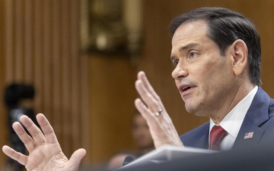 Rubio gestures with both hands during testimony.