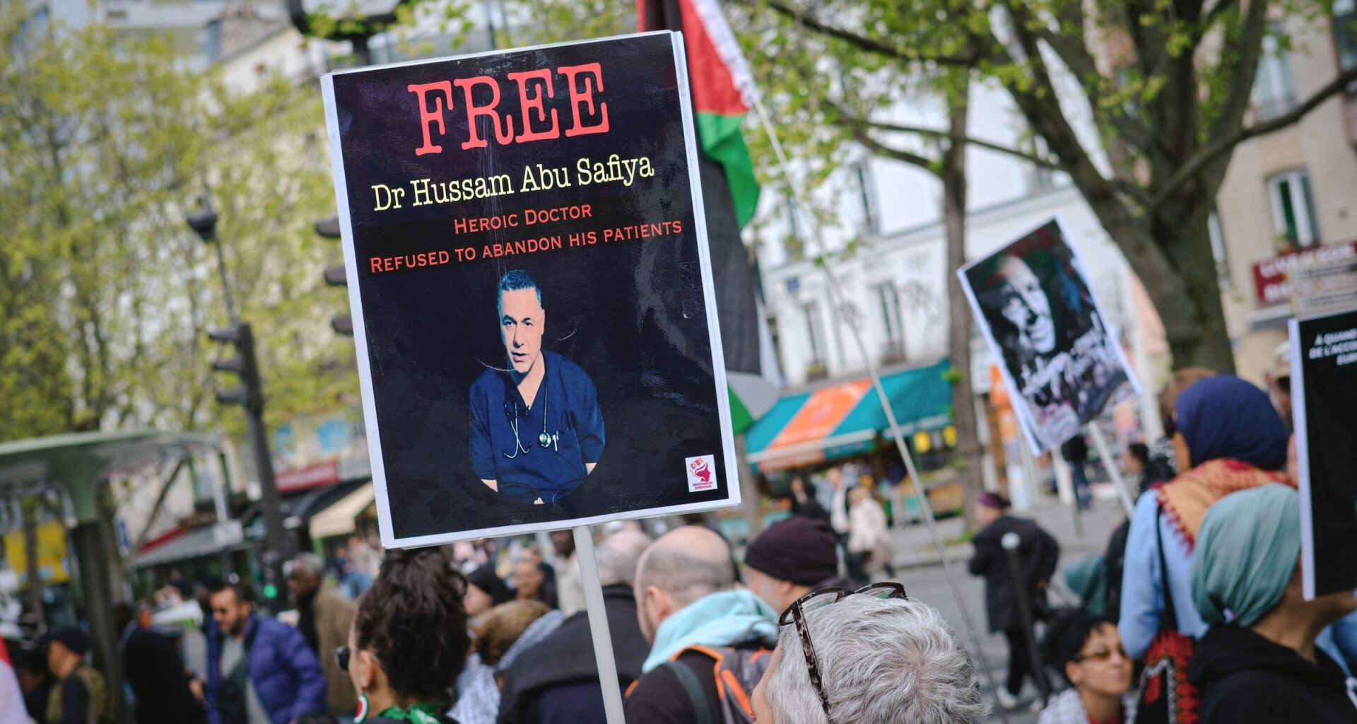 A protestor holds a sign reading Free Hussam Abu Safiya during a pro Palestine demonstration in Paris on April 18, 2026.