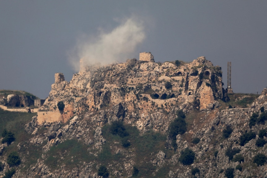 Smoke rises from Beaufort Castle following strikes.