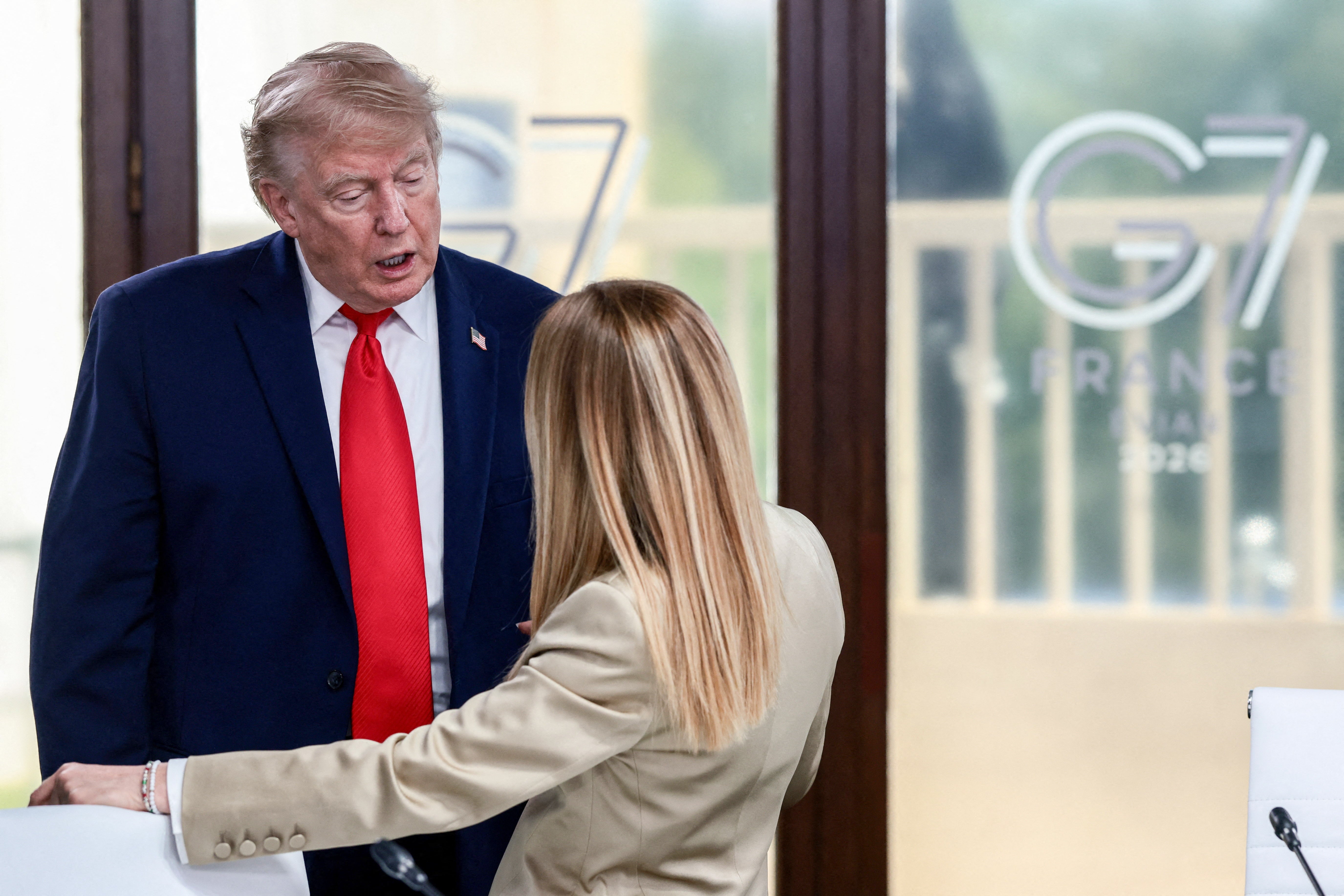 Meloni, pictured with Trump at the G7, said that Italy does not ‘beg’