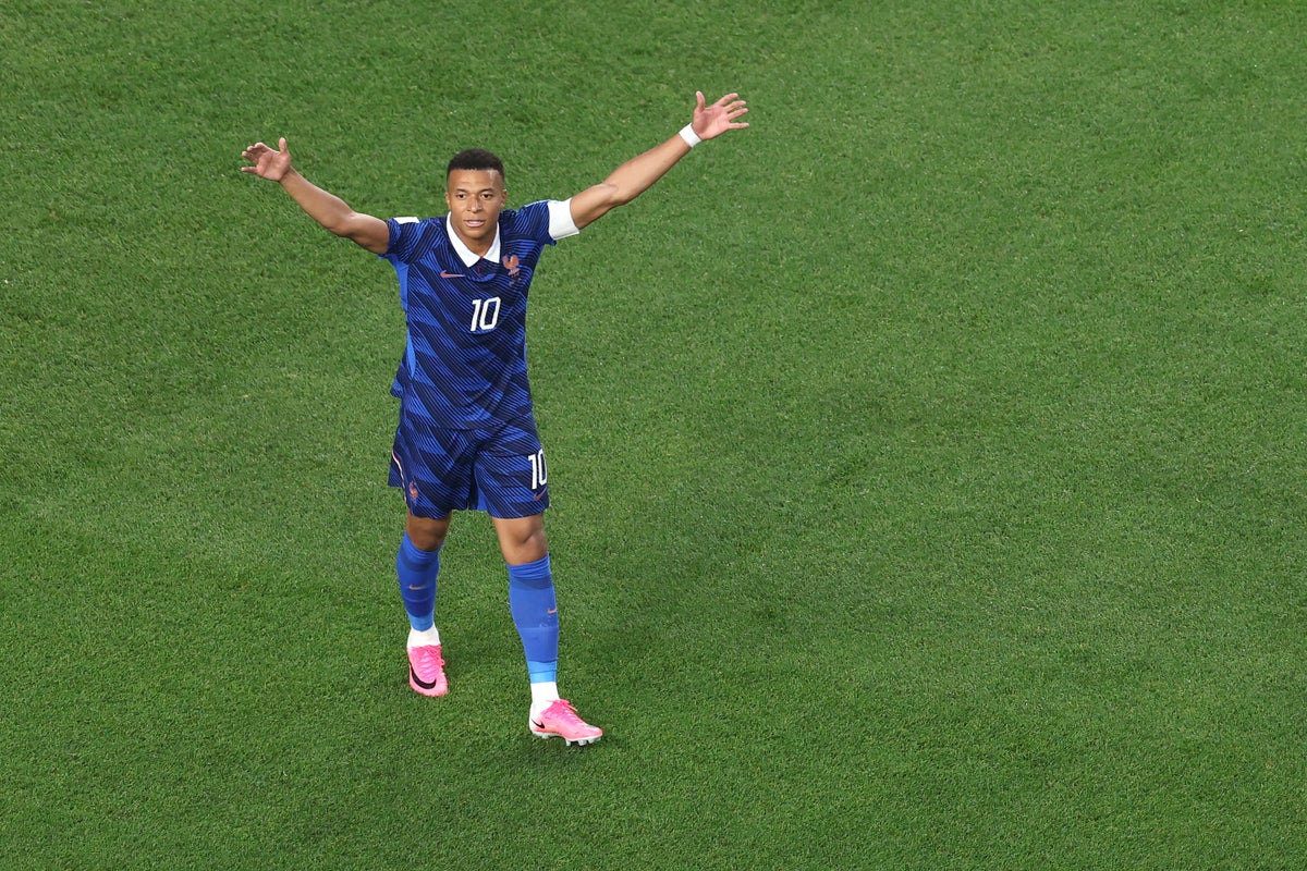 Kylian Mbappe makes a statement as France overcome two-hour storm delay to beat Iraq at World Cup