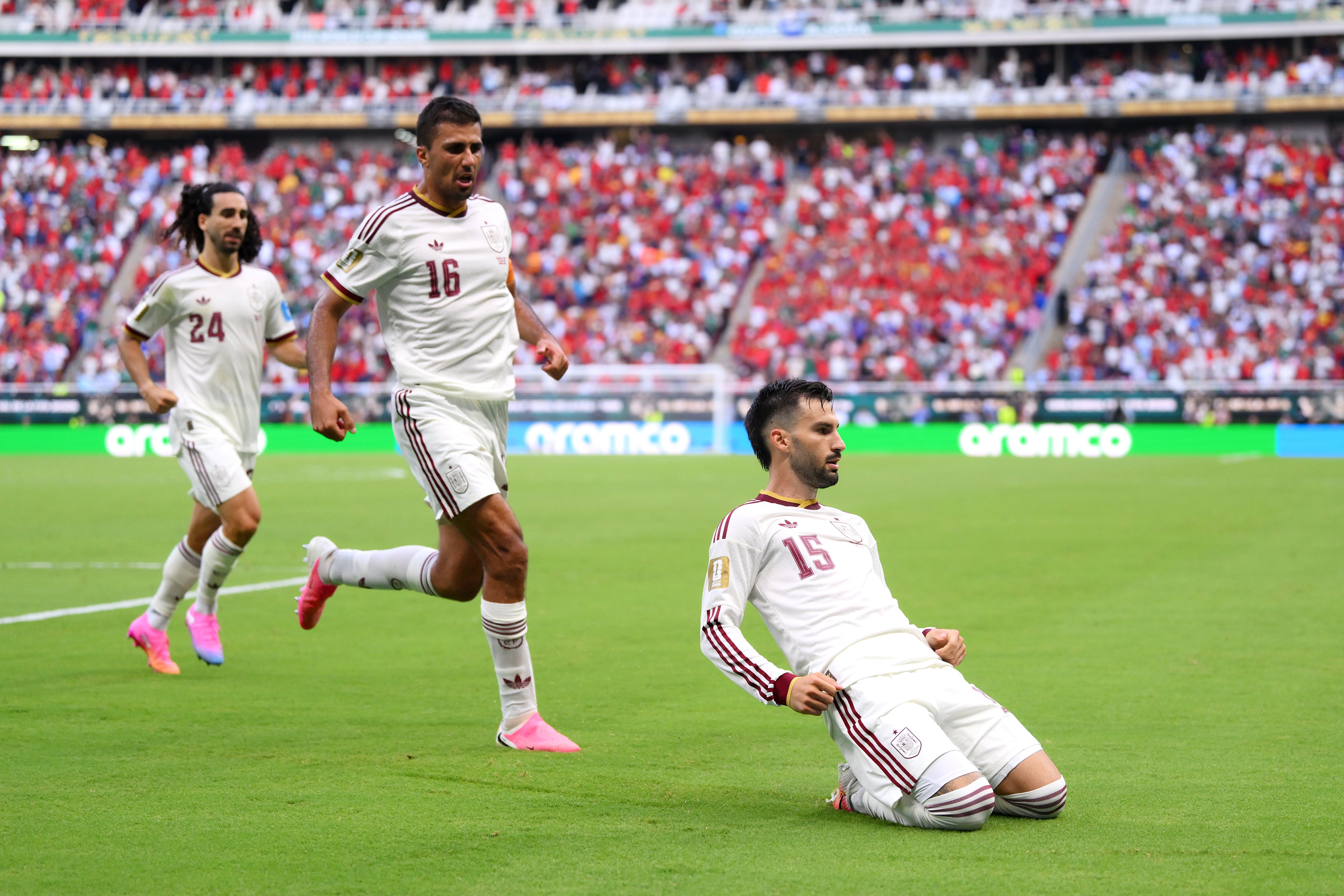 Spain topped the group with victory over Uruguay
