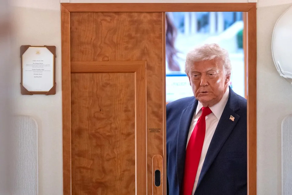 President Donald Trump arrives to speak to reporters aboard Air Force One en route from Joint Base Andrews, Md., to Eau Claire, Wisconsin, on June 5, 2026.