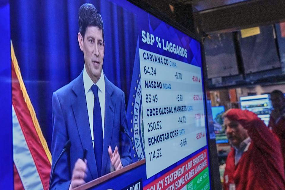 Federal Reserve Chairman Kevin Warsh's press conference appears on a screen on the floor of the New York Stock Exchange on June 17, 2026. (AP Photo/Richard Drew)