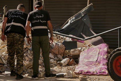 Lebanese intelligence officers look at an unexploded missile at the site where an Israeli airstrike hit a building in Dahiyeh, Beirut's southern suburb, Lebanon, Sunday. Credit: Hassan Ammar/AP Lebanese intelligence officers look at an unexploded missile at the site where an Israeli airstrike hit a building in Dahiyeh, Beirut's southern suburb, Lebanon, Sunday.