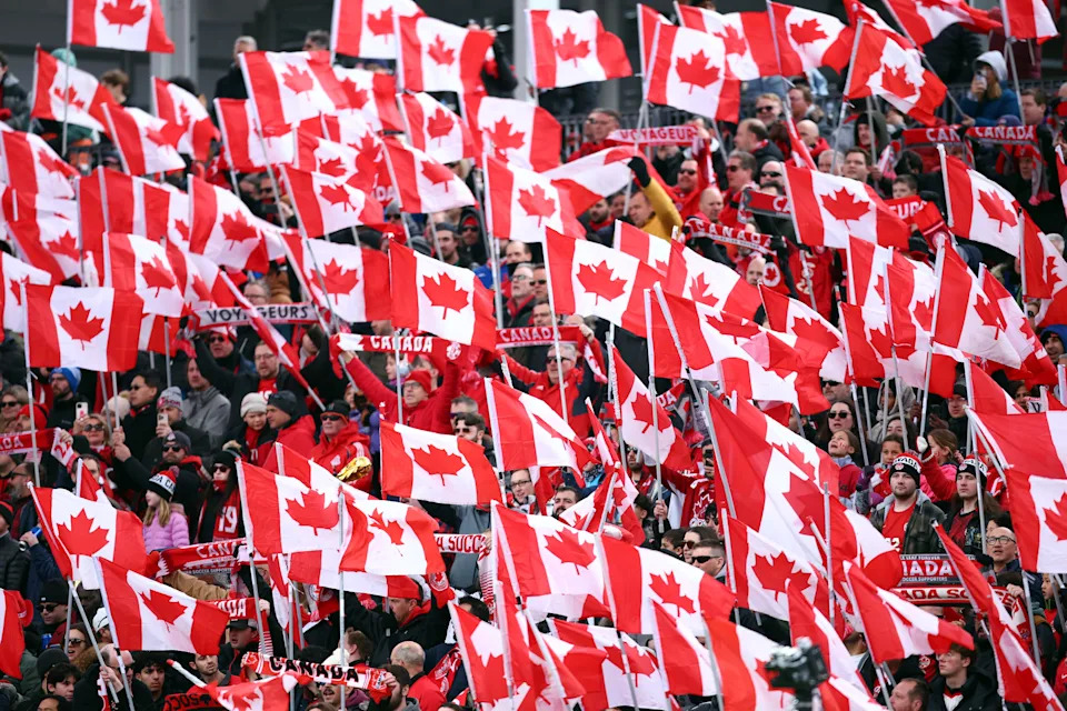 Canada fans wave flags before the International Friendly between Canada and Iceland at BMO Field on March 28, 2026 in Toronto, Ontario, Canada.