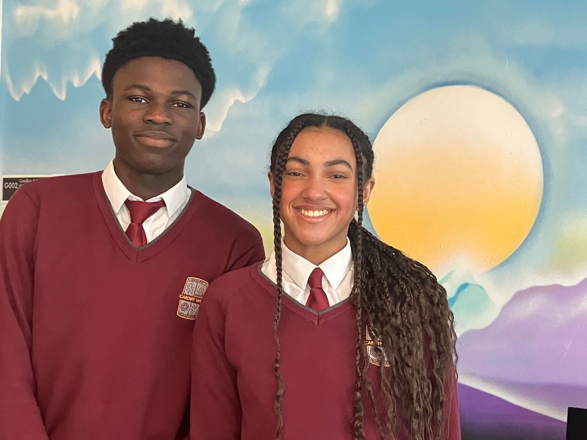 Two teenage school pupils in uniform