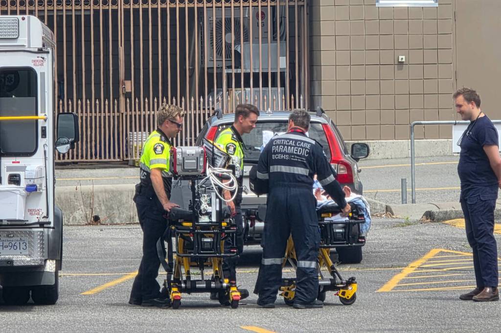 A young patient is cared for by paramedics at Cultus Lake Waterpark on June 15, 2026. (Corey Chase/ Submitted)