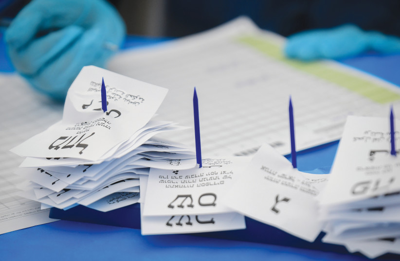 VOTES ARE counted at a tent in the Central Elections Committee warehouse in Shoham last March.