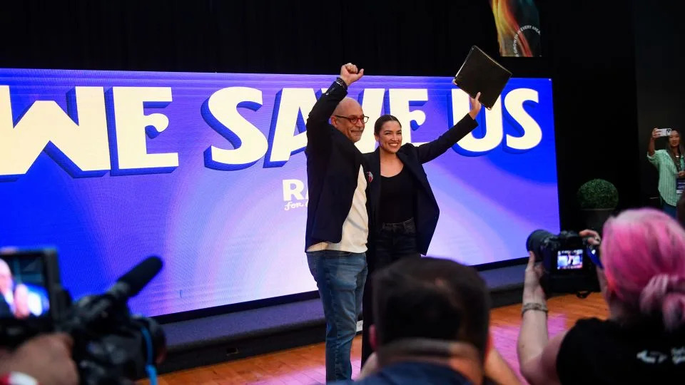 Pennsylvania State Rep. Chris Rabb and US Rep. Alexandria Ocasio-Cortez of New York share the stage during a Rabb for Congress rally on May 15 in Philadelphia. - Matthew Hatcher/Getty Images