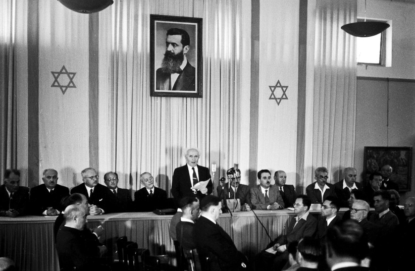 David Ben-Gurion publicly pronouncing the Declaration of the State of Israel, May 14, 1948, beneath a large portrait of Theodor Herzl, founder of modern political Zionism, in the old Tel Aviv Museum of Art building on Rothschild Street.