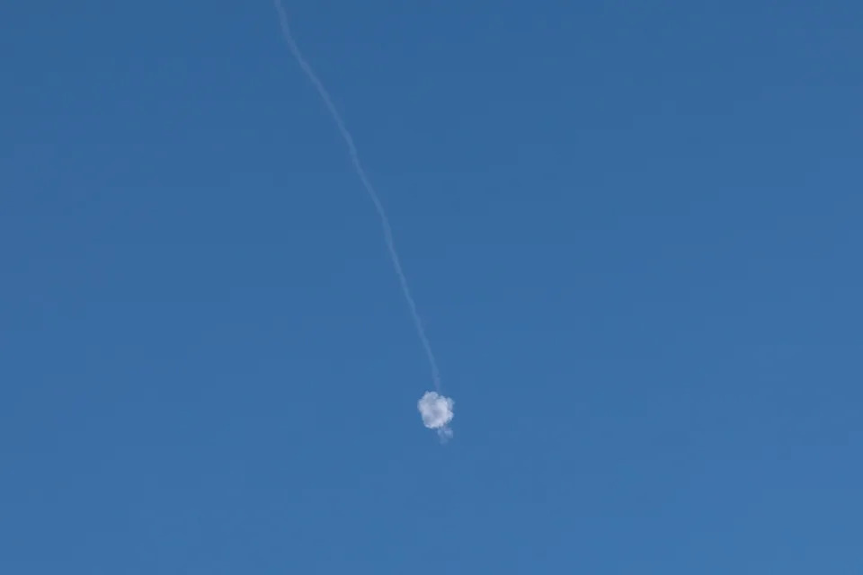 Ahmad Gharabli/AFP via Getty Images - PHOTO: A trail of smoke from the interception of an Iranian attack is pictured over Jerusalem on June 8, 2026.