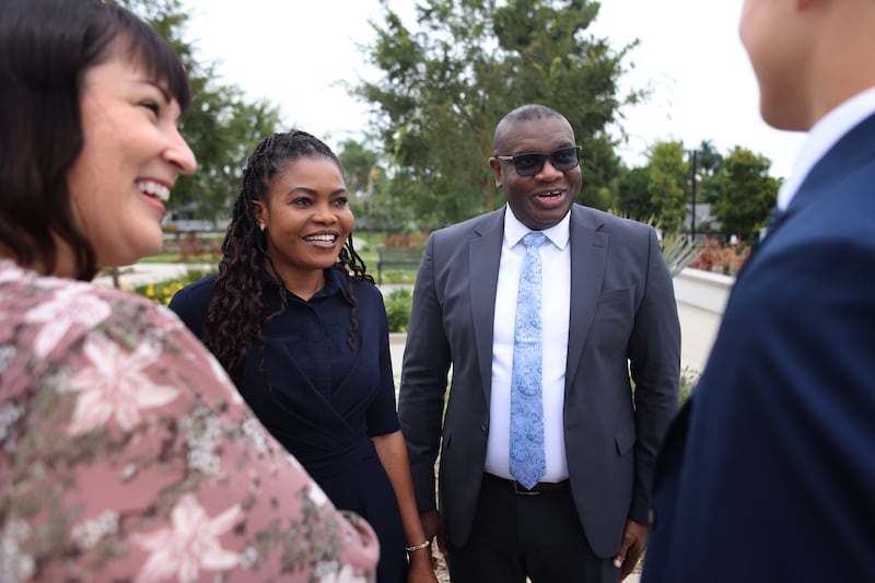 Elder I. Raymond Egbo, assistant executive director of the Temple Department, and his wife, Sister Comfort Egbo, talk with attendees at the dedication of the Yorba Linda California Temple on Sunday, June 7, 2026.