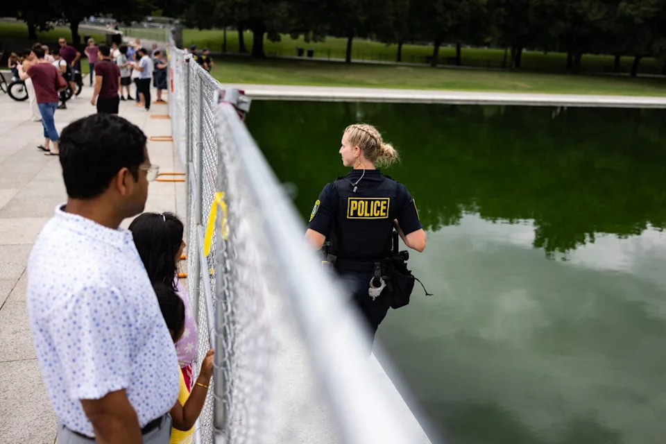 The site of the Reflecting Pool has become a secure scene as passerby have been blocked from touching the pool's waters or getting close (Getty)