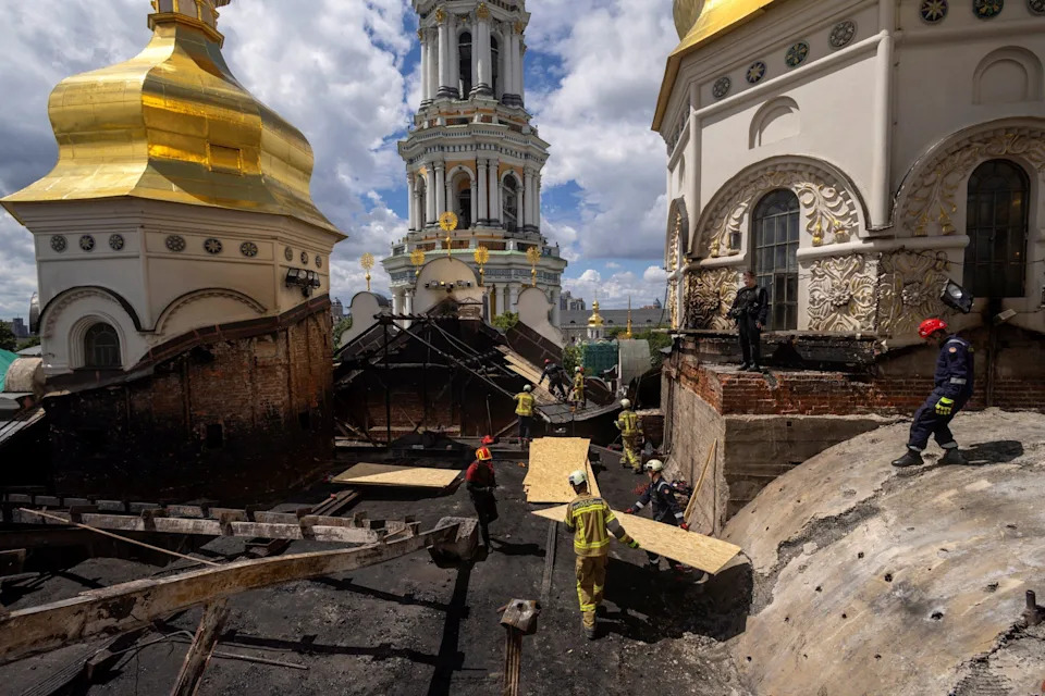 Workmen repair the Dormition cathedral in Kyiv after a Russian attack last week