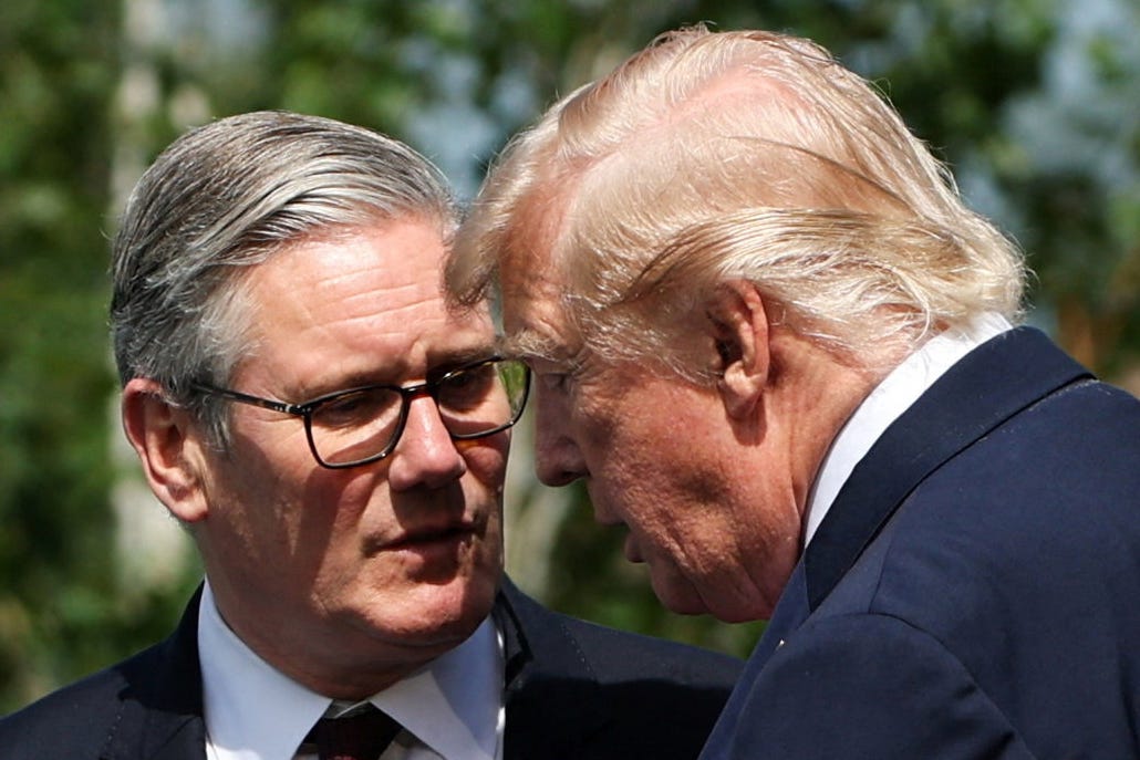 Prime Minister Sir Keir Starmer (left) and U.S. President Donald Trump talk ahead of a family photo during the G7 summit in Evian, France