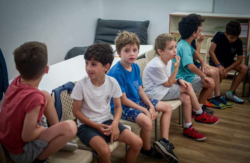 Israeli children going into 1st grade seen on the first day of school at the Gabrieli Carmel School in Tel Aviv on September 1, 2023.