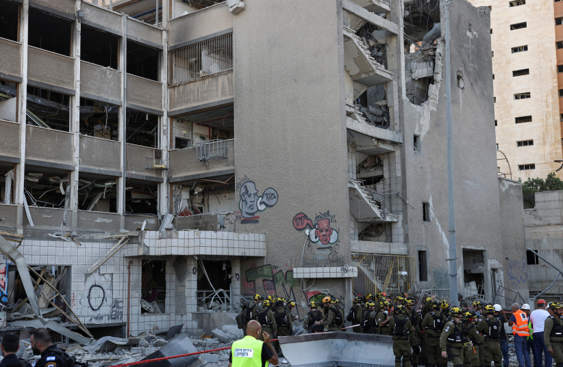 Emergency personnel work at an impact site following Iran's missile strike on Israel, amid the Iran-Israel conflict, in Haifa, Israel, June 20, 2025.