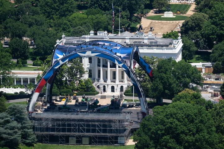 Workers build a structure for the upcoming UFC fight on the South Lawn of the White House as seen from on May 31.