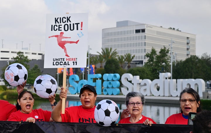 Workers protest outside SoFi Stadium ahead of the 2026 FIFA World Cup in Inglewood, California, on May 18, 2026. Members of Unite Here Local 11 are fighting to keep ICE out of their workplace during the tournament.