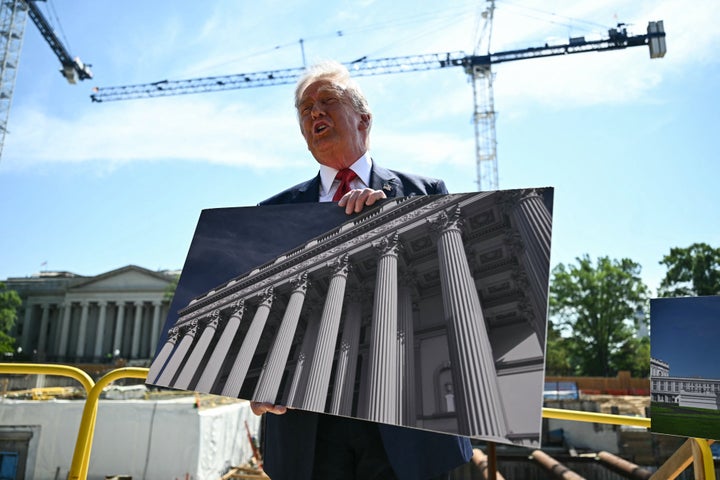 President Donald Trump speaks to the press near the construction site of his proposed White House ballroom.