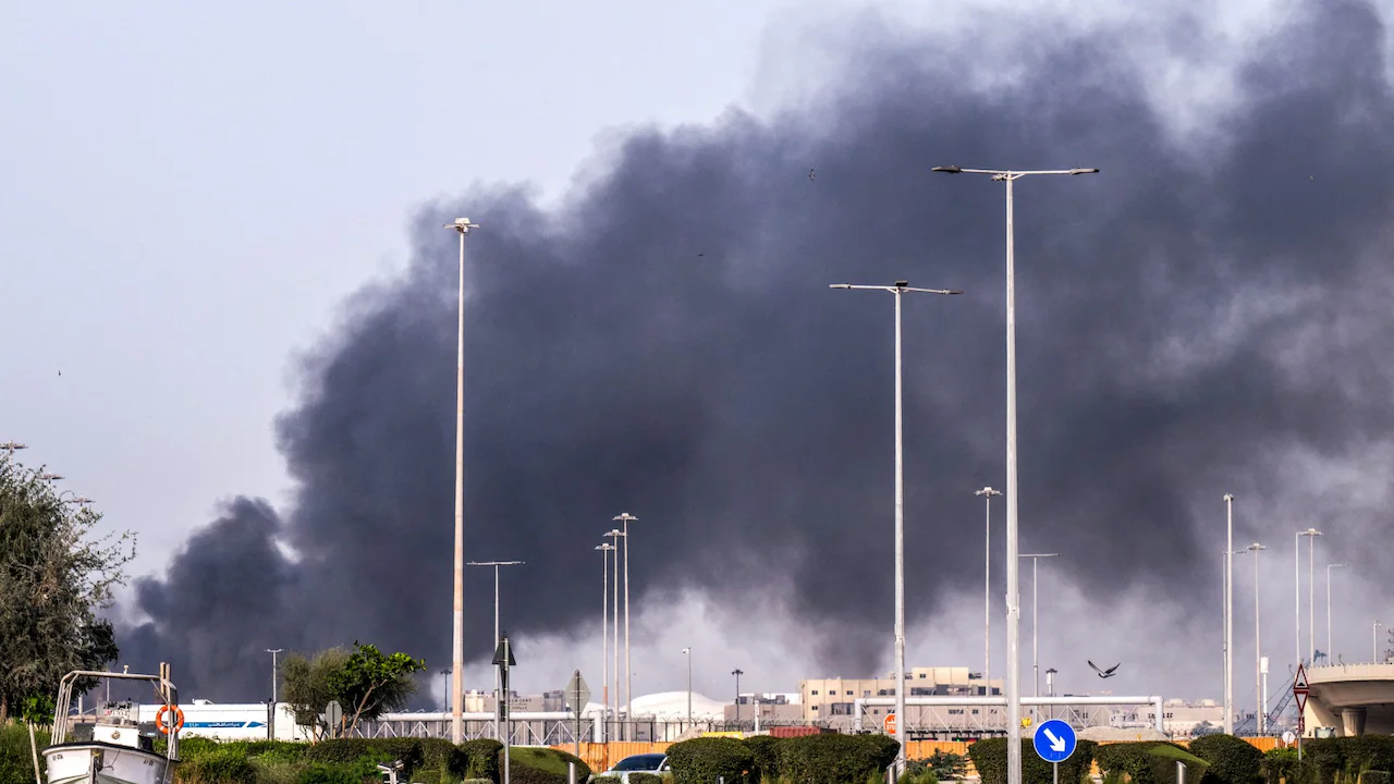 A plume of smoke rises from the Zayed Port following a reported Iranian strike in Abu Dhabi on March 1