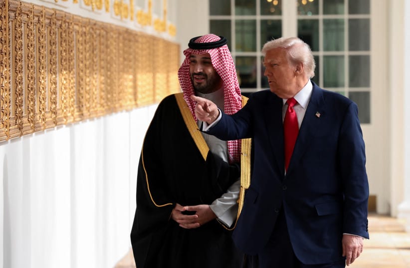 US President Donald Trump and Saudi Crown Prince and Prime Minister Mohammed bin Salman look at portraits at the ''Presidential Walk of Fame'' in the Colonnade at the White House in Washington, DC, November 18, 2025.