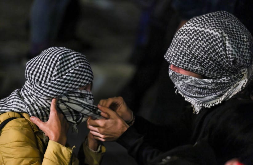 Pro-Palestinian demonstrators wear keffiyeh at a protest to condemn the interception of the vessels of the Global Sumud Flotilla, in Rome, Italy, October 1, 2025.