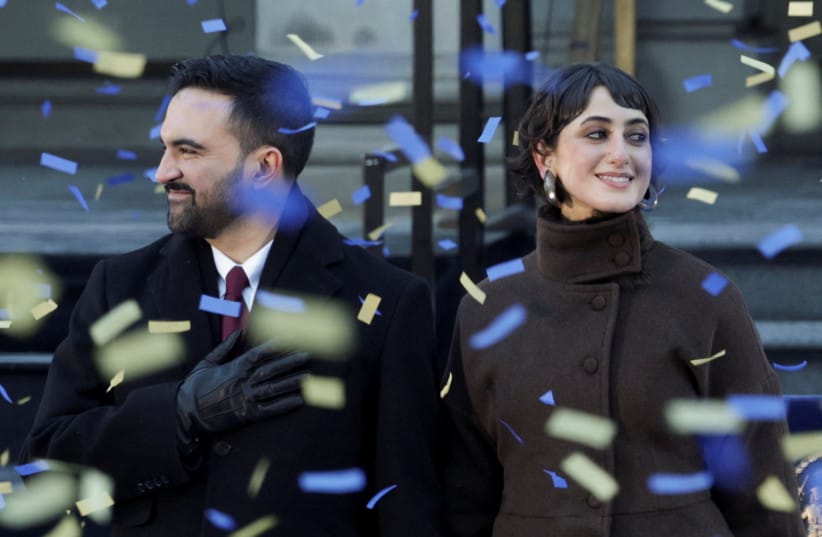 New York City Mayor Zohran Mamdani and his wife Rama Duwaji react as confetti falls during his inauguration ceremony in New York City, US, January 1, 2026.