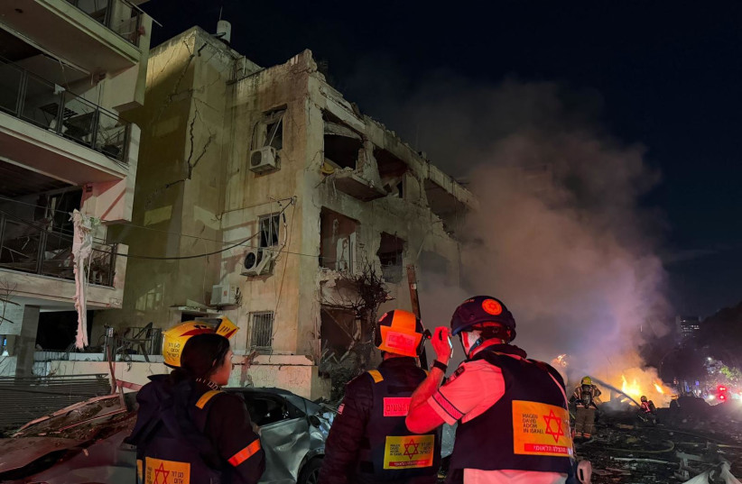 Magen David Adom responds after a Tel Aviv building is hit by an Iranian rocket.