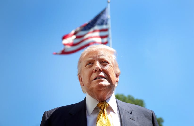 US President Donald Trump speaks to the press as he departs the White House in Washington in May.