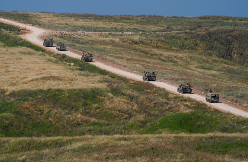 ISRAELI SELF-PROPELLED artillery vehicles travel in a convoy toward southern Lebanon near the Israeli-Lebanese border, May 27, 2026.