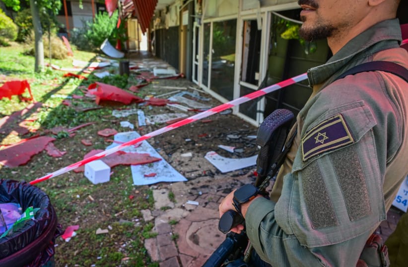 Israeli security forces and civilians at the scene where a missile fired from Lebanon toward Israel overnight caused damage in the northern Israeli city of Kiryat Shmona, May 30, 2026.