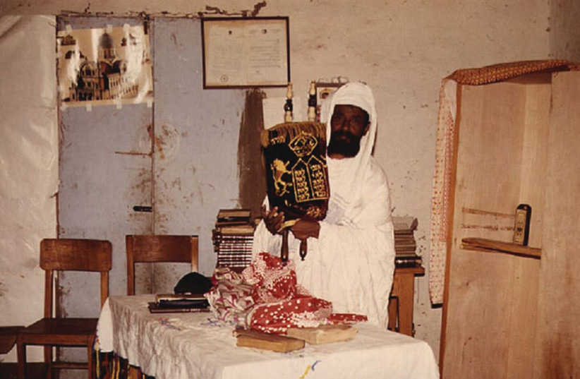 A ‘Kahen’ displays a Torah scroll in Ethiopia.