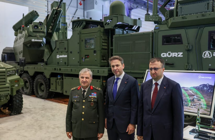 Aselsan CEO Ahmet Akyol poses with Turkey's Energy Minister Alparslan Bayraktar and Commander of the Land Forces General Metin Tokel, with Aselsan air defence systems in the background, at the SAHA 2026 International Defence and Aerospace Exhibition in Istanbul, Turkey, May 8, 2026.