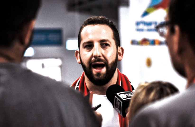 Hapoel Jerusalem owner Matan Adelson speaks with reporters about the handling of the halted Game 1 of the series.